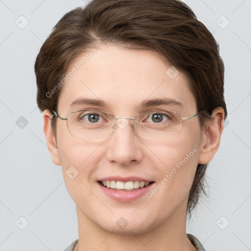 Joyful white young-adult female with short  brown hair and grey eyes