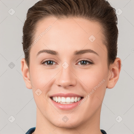 Joyful white young-adult female with short  brown hair and brown eyes