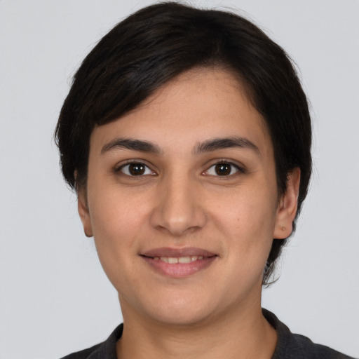 Joyful white young-adult female with short  brown hair and brown eyes