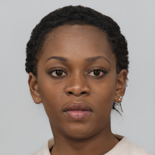 Neutral black young-adult female with short  brown hair and brown eyes