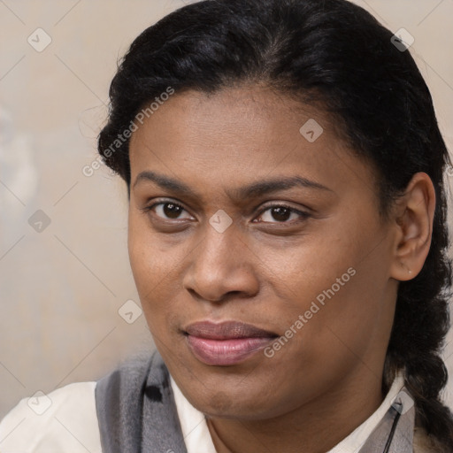 Joyful black young-adult female with medium  brown hair and brown eyes