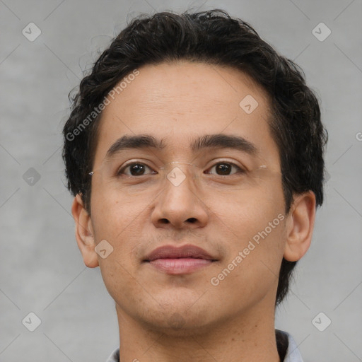 Joyful latino young-adult male with short  brown hair and brown eyes