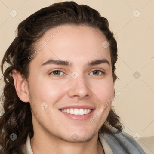 Joyful white young-adult male with medium  brown hair and brown eyes