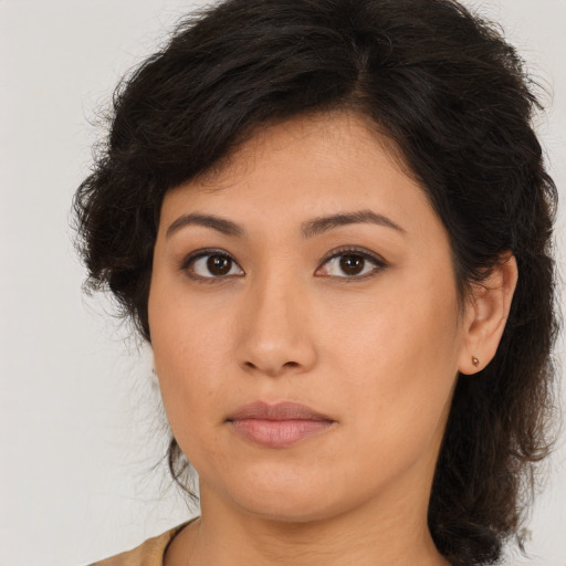 Neutral latino young-adult female with medium  brown hair and brown eyes