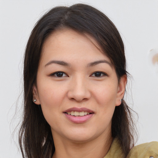 Joyful asian young-adult female with long  brown hair and brown eyes