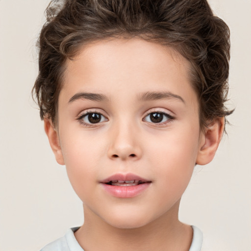 Joyful white child female with short  brown hair and brown eyes