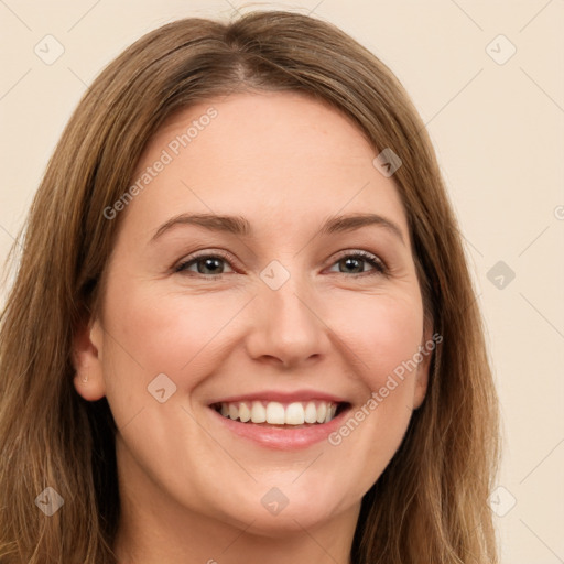 Joyful white young-adult female with long  brown hair and green eyes