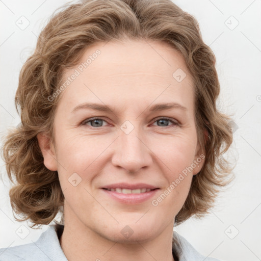 Joyful white young-adult female with medium  brown hair and blue eyes