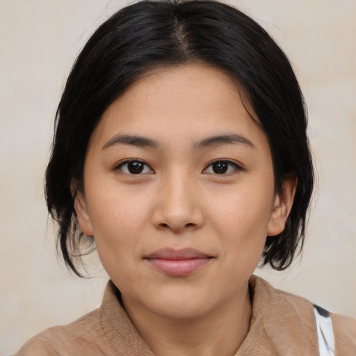 Joyful latino young-adult female with medium  black hair and brown eyes