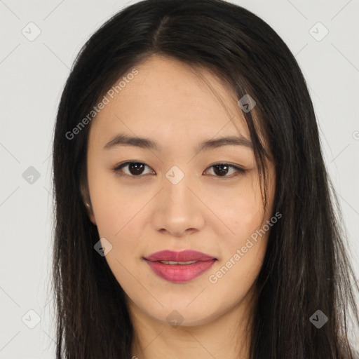 Joyful asian young-adult female with long  brown hair and brown eyes