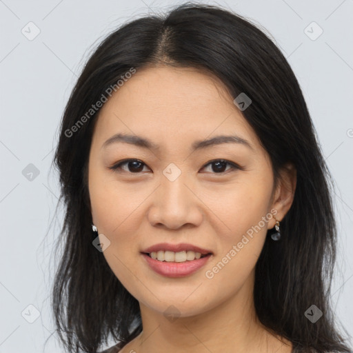 Joyful asian young-adult female with long  brown hair and brown eyes