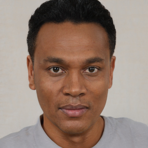 Neutral black young-adult male with short  black hair and brown eyes