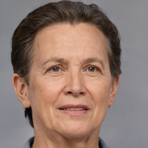 Joyful white middle-aged female with short  brown hair and brown eyes