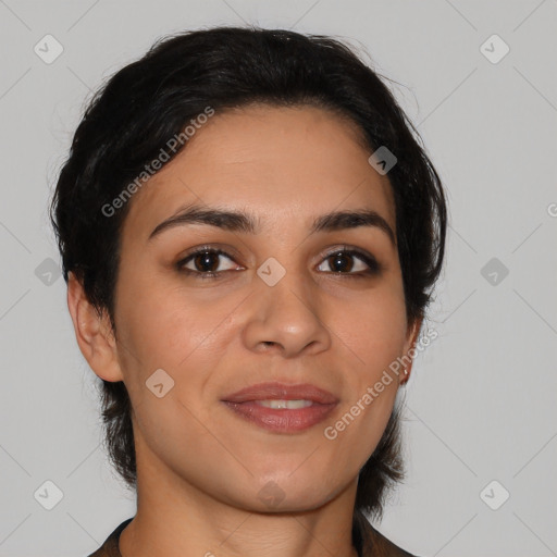 Joyful latino young-adult female with medium  brown hair and brown eyes