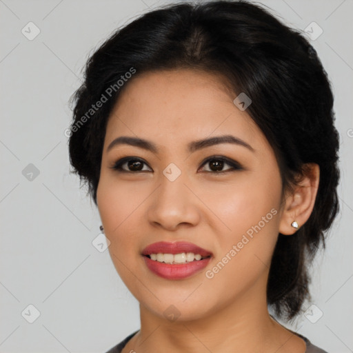 Joyful asian young-adult female with medium  black hair and brown eyes