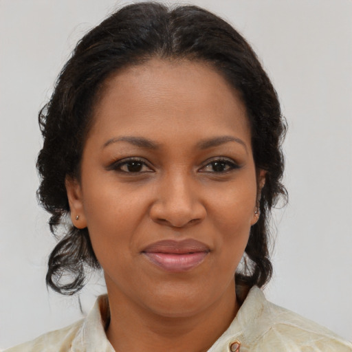 Joyful black young-adult female with medium  brown hair and brown eyes