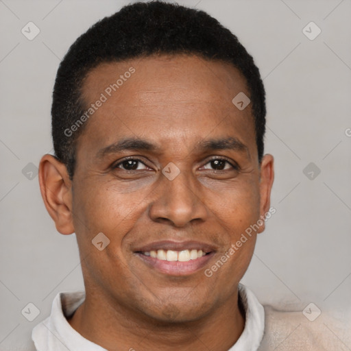 Joyful black young-adult male with short  brown hair and brown eyes