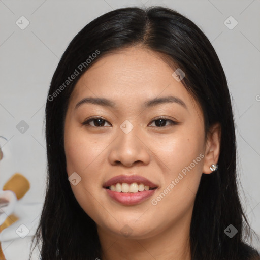 Joyful asian young-adult female with long  brown hair and brown eyes