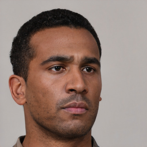 Neutral latino young-adult male with short  brown hair and brown eyes