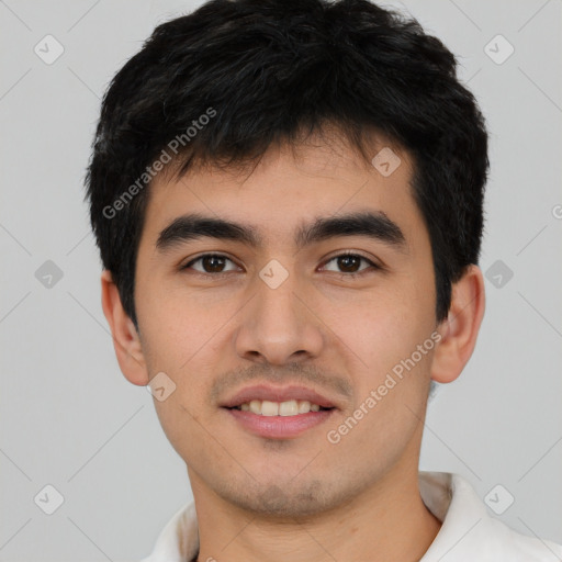 Joyful asian young-adult male with short  brown hair and brown eyes