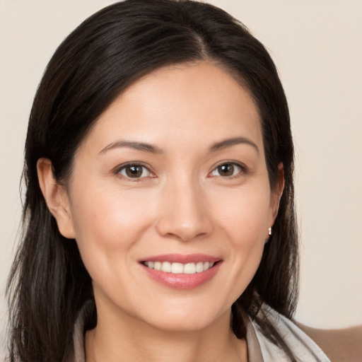 Joyful white young-adult female with medium  brown hair and brown eyes