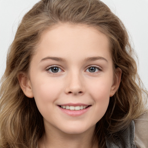 Joyful white child female with long  brown hair and brown eyes