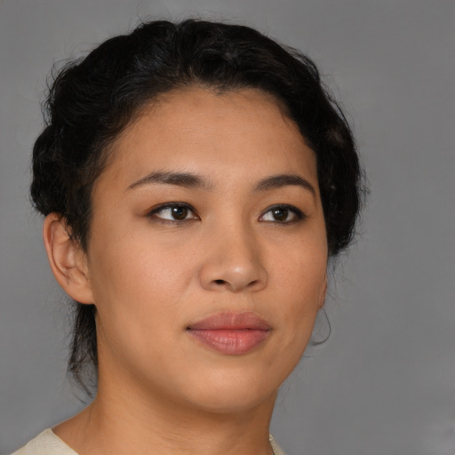 Joyful asian young-adult female with short  brown hair and brown eyes