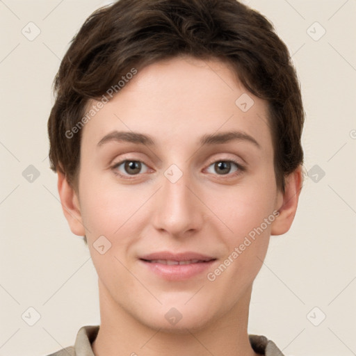 Joyful white young-adult female with short  brown hair and grey eyes