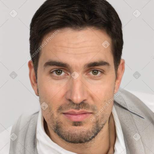 Joyful white adult male with short  brown hair and brown eyes