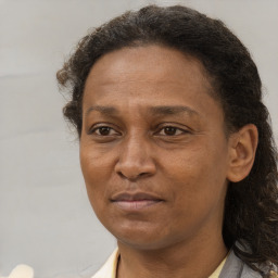 Joyful black adult female with short  brown hair and brown eyes