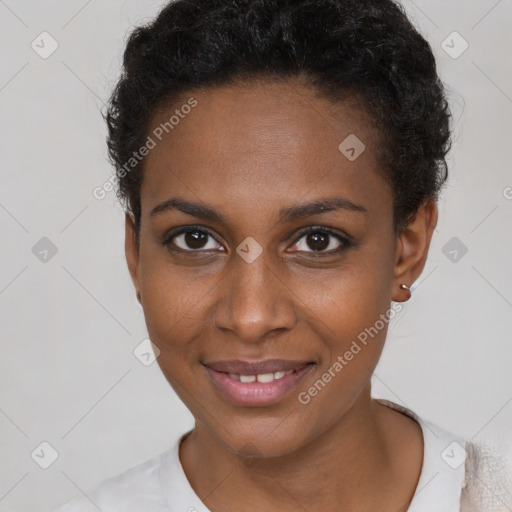 Joyful black young-adult female with short  brown hair and brown eyes