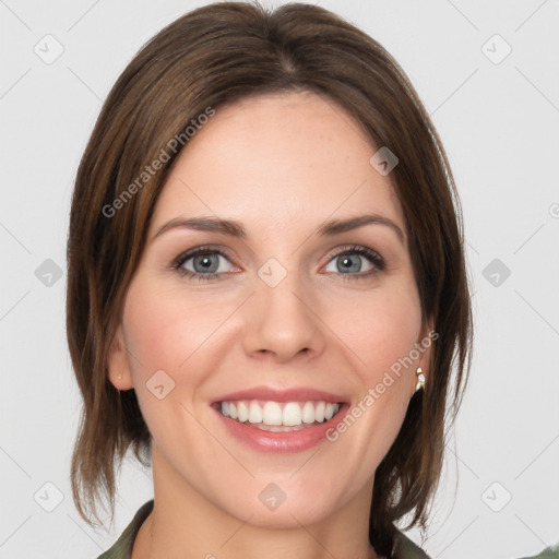 Joyful white young-adult female with medium  brown hair and green eyes