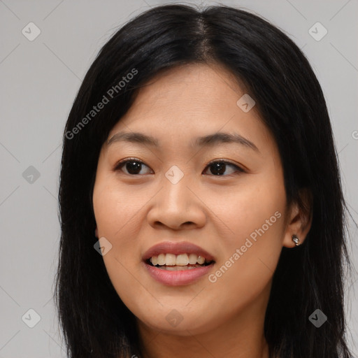 Joyful asian young-adult female with long  black hair and brown eyes