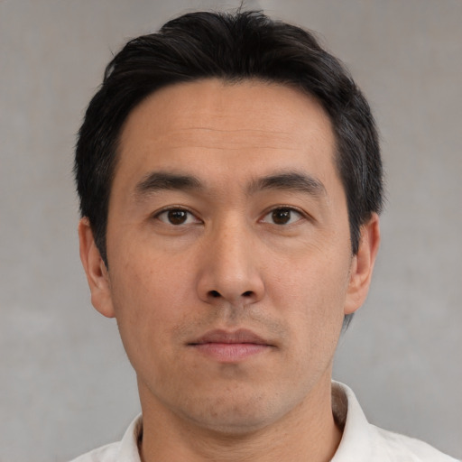 Neutral asian young-adult male with short  brown hair and brown eyes