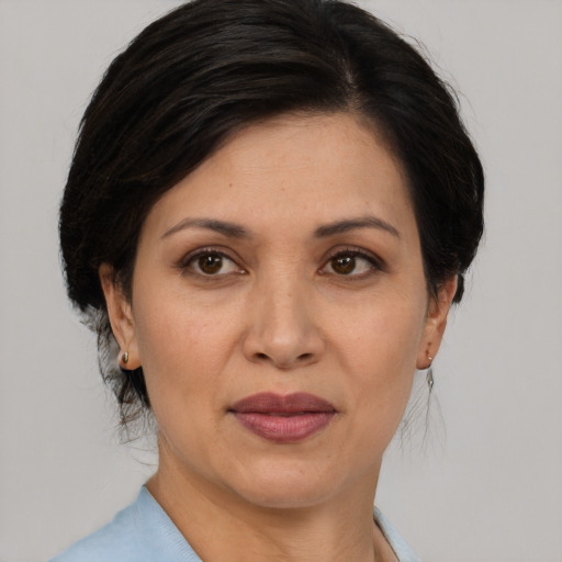 Joyful white adult female with medium  brown hair and brown eyes