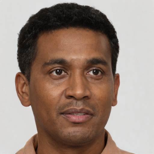 Neutral latino young-adult male with short  brown hair and brown eyes