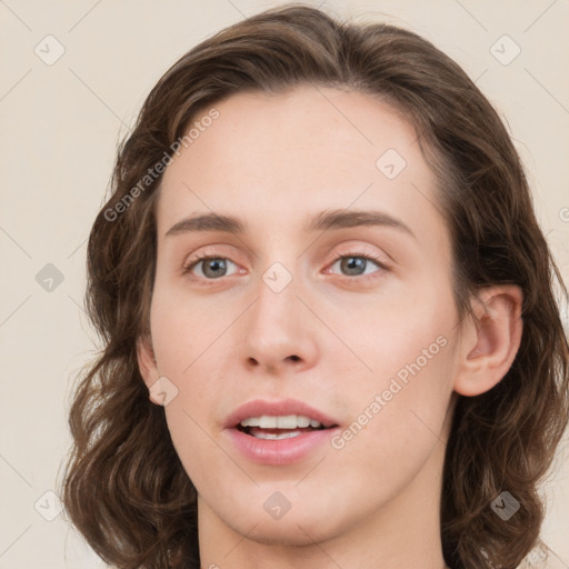 Joyful white young-adult female with medium  brown hair and green eyes