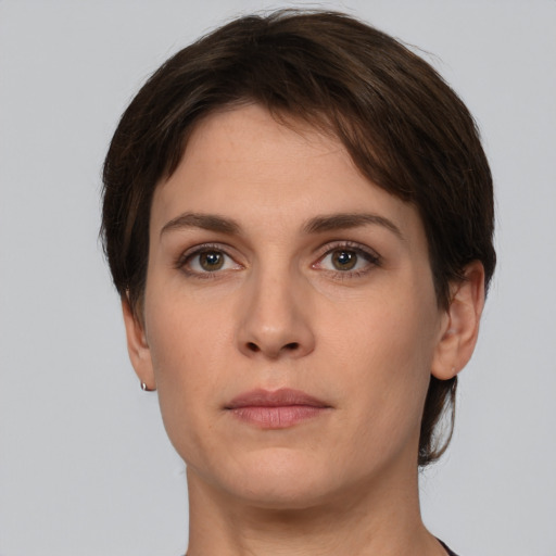 Neutral white young-adult female with short  brown hair and brown eyes