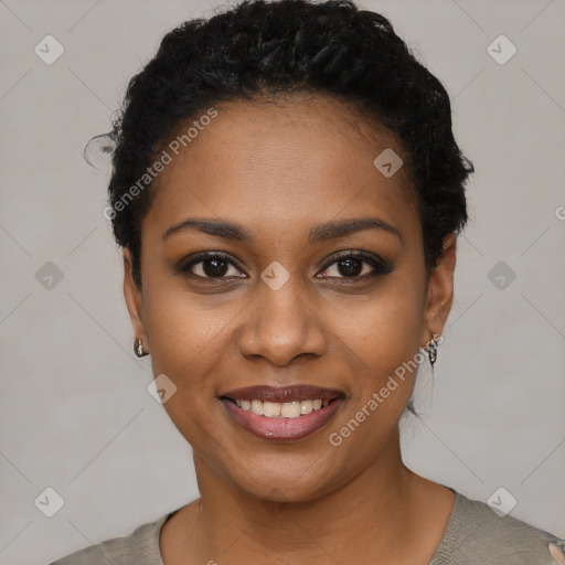 Joyful black young-adult female with short  black hair and brown eyes