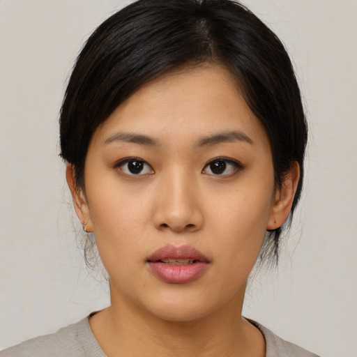 Neutral asian young-adult female with medium  black hair and brown eyes
