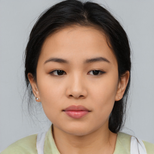 Neutral asian young-adult female with medium  brown hair and brown eyes
