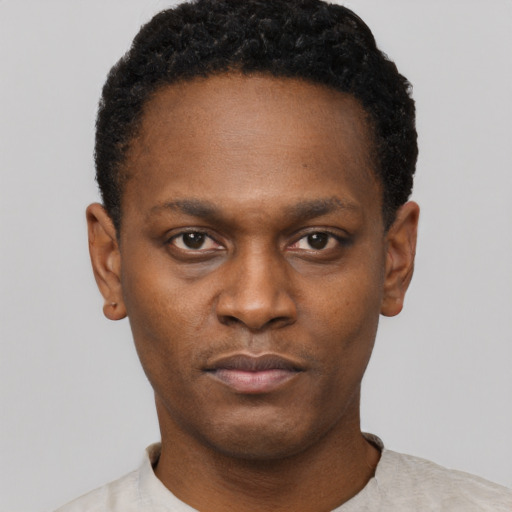 Neutral black young-adult male with short  black hair and brown eyes