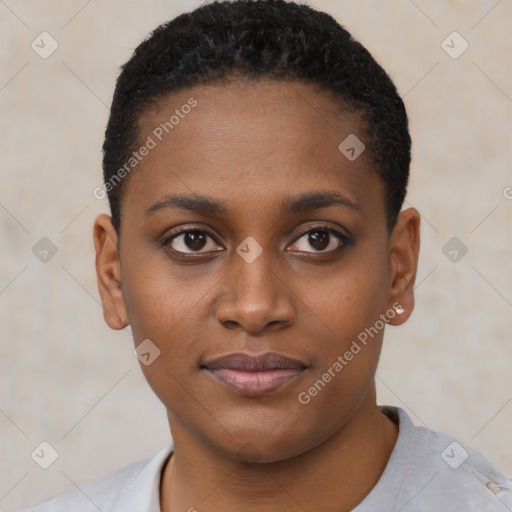 Joyful black young-adult female with short  black hair and brown eyes