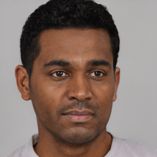 Neutral black young-adult male with short  black hair and brown eyes