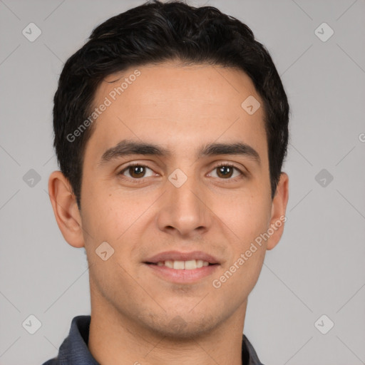 Joyful white young-adult male with short  black hair and brown eyes