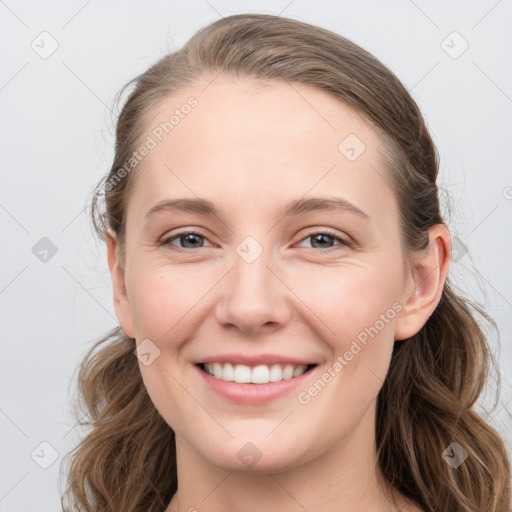 Joyful white young-adult female with long  brown hair and grey eyes