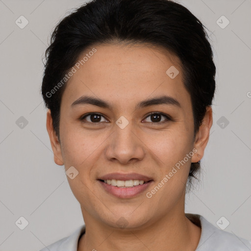 Joyful latino young-adult female with short  brown hair and brown eyes