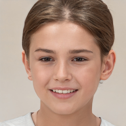 Joyful white child female with short  brown hair and brown eyes