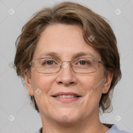 Joyful white adult female with medium  brown hair and grey eyes