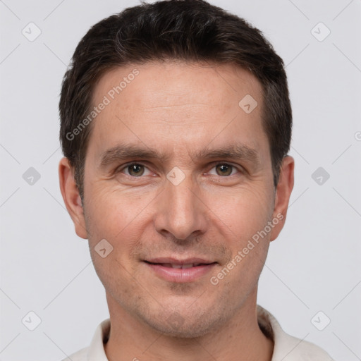 Joyful white adult male with short  brown hair and brown eyes